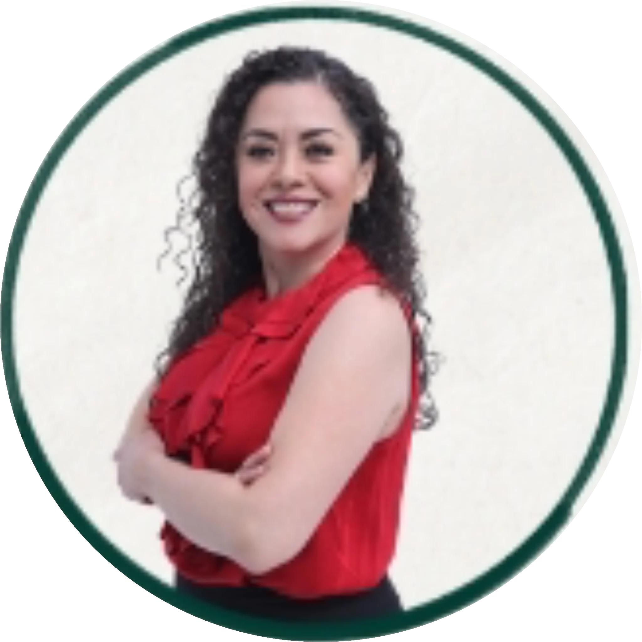 Professional portrait of a smiling woman with long curly dark hair wearing a red sleeveless top, arms crossed